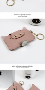 Detail of slim 0.6cm pink cat card holder with gold snap and key ring attachment