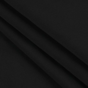 Close-up of the black woven fabric texture and soft pleats on this elegant long sleeve dress