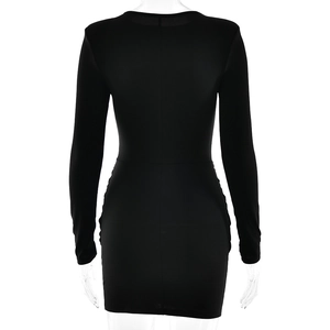 Back view of a black slim fit long sleeve mini dress featuring ruched bodycon details