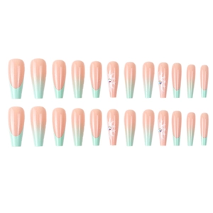 Long ballerina press-on nails with white flowers, rhinestones, and French gradient design