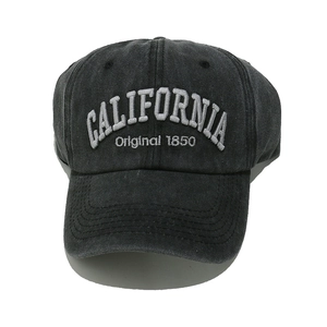Detailed view of CALIFORNIA vintage embroidery and washed grey cotton twill fabric