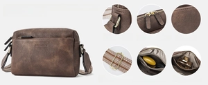 Detail view of small faux leather crossbody bag with triple zippers and woven strap