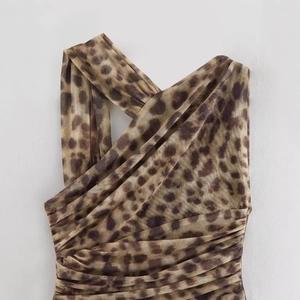 Leopard print halter neck dress with pleated mesh fabric and crisscross neckline