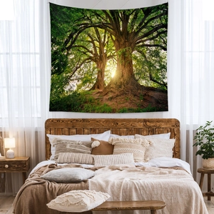 Detail of forest sunrise wall tapestry with soft fabric texture in a cozy bedroom