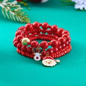 Set di bracciali natalizi con perline rosse e ciondoli alce e Babbo Natale su pino verde