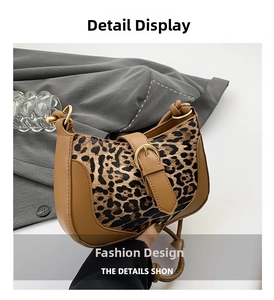 Detail of leopard print patchwork shoulder bag with gold buckle and knotted strap design