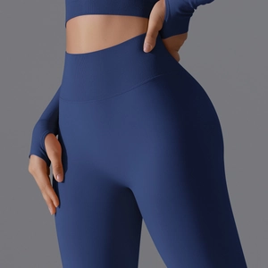 Close-up of seamless ribbed high-waist yoga leggings and long sleeve top with thumbholes