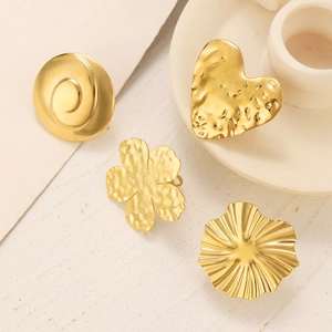 Detailed close-up of vintage 18K gold plated earrings set with hammered and wavy textures