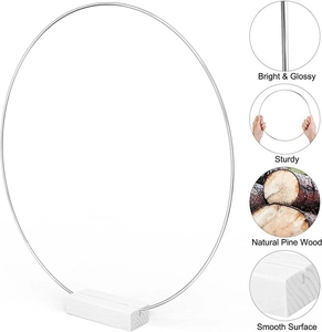 Detail view of bright glossy metal hoop with natural pine wood base for DIY wreath