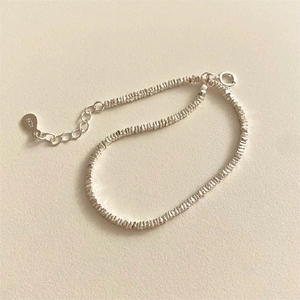 Detail view of S925 sterling silver crushed silver bracelet with lobster clasp and chain
