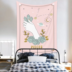 Detail view of Pisces constellation tapestry with sun and moon art in a bedroom setting
