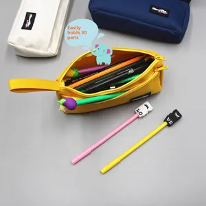 Detail of high-capacity canvas pencil case showing double zippers and 30-pen storage