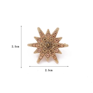 Sparkling gold starburst brooch pin with crystals for suits and shirts, 2.5cm diameter