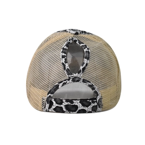 Detail view of the ponytail hole and leopard print adjustable strap on mesh trucker hat