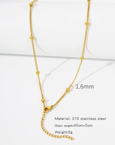Macro detail of 18k gold plated 316L stainless steel chain with 1.6mm beads