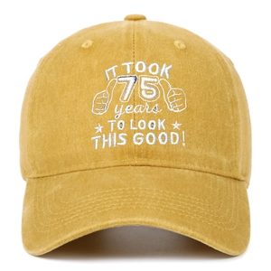 Detail of 75th birthday embroidery on a washed cotton vintage yellow baseball cap