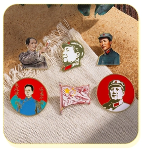 Detailed close-up of Chairman Mao enamel badges and five-star red flag on burlap surface