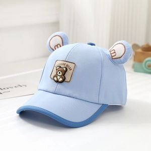 Detail of baby baseball cap with 3D bear ears and brown leather outdoor patch