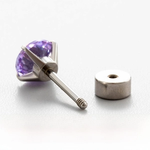Close-up of titanium steel cartilage stud with purple zircon and screw back closure