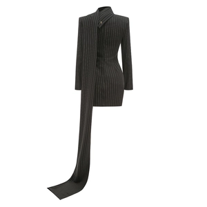 Detail of black pinstripe blazer dress showing elegant long shoulder ribbons and slim fit