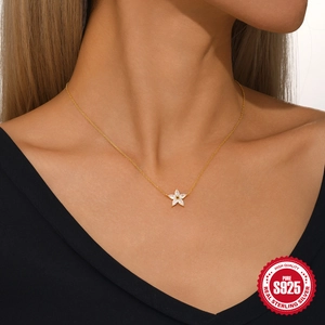 Elegant S925 sterling silver gold star necklace featuring clear marquise-cut stones on a model