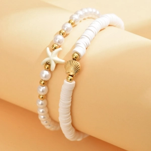 Starfish shell faux pearl layered anklet set on sand beige display stand