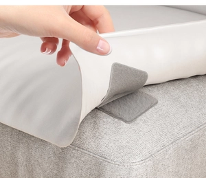 Close-up of white invisible sofa cushion fastener with leather texture and velcro grip
