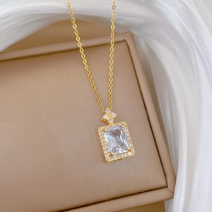 Luxurious gold titanium steel necklace featuring a square zircon pendant with sparkling accents