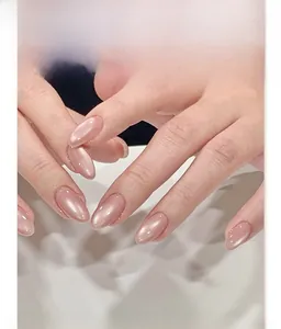 Macro shot of pearl pink cat eye almond press-on nails with shimmering finish