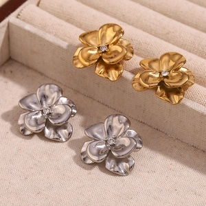 18K gold and silver double-layered floral earrings with sparkling center crystals
