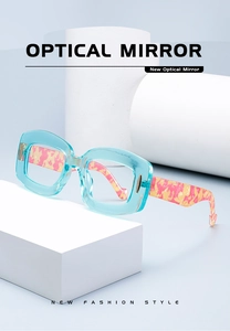 Detail of blue transparent square glasses frames with marble texture temples on stone