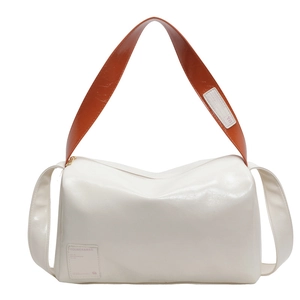 Large capacity Boston bag in cream leather with contrast caramel brown shoulder strap