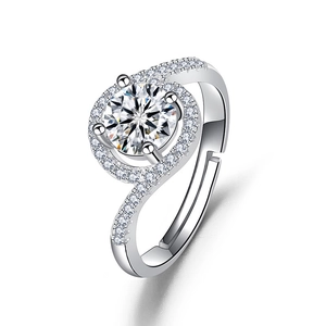 Macro detail of silver adjustable ring featuring brilliant halo setting and twisted band