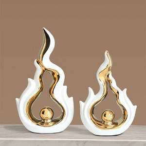 Modern white and gold flame ceramic sculptures with marble texture background for home decor