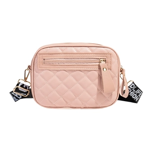 Pink quilted crossbody bag with patterned wide strap and front zipper pocket on white base