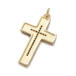 Close-up of gold-plated cross pendant featuring micro-set dark stones and textured finish