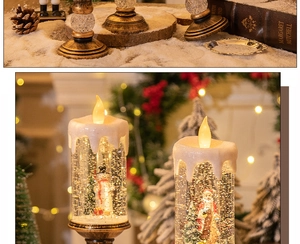 Detail of vintage bronze Christmas LED candle lamp with Santa snow globe and warm holiday glow