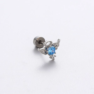 Titanium steel winged ear stud with blue zircon and clear stones on white background