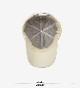 Detailed inside view of the baseball cap showing grey diamond quilted thermal lining