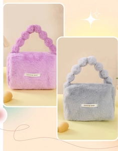 Detail of plush vanity bags in purple and grey with beaded handles and COISINIBAG label