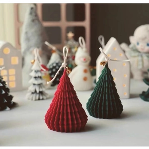 Modern Christmas tree resin candles in red and green with bell accents and cotton wicks