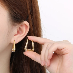 Chic 18K gold plated U-shaped triangular hoop earrings with sparkling zircon on model