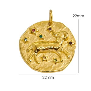 Detail of 22mm hammered 14K gold stainless steel Capricorn pendant with colored gems