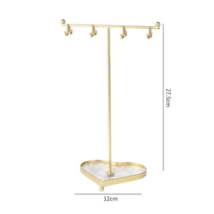 Golden jewelry stand with heart-shaped marble base and dimensions 27.5cm by 12cm