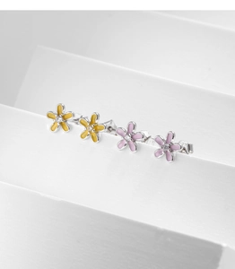 Detailed view of flower earrings with s925 stamp, enamel petals and cubic zirconia center