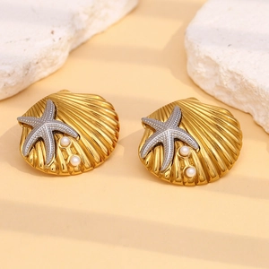 Detail view of starfish and seashell earrings with 18K gold plating and pearls