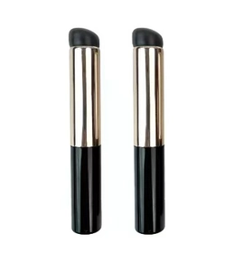 Detailed view of two silicone lip brushes with black handles and metallic ferrules