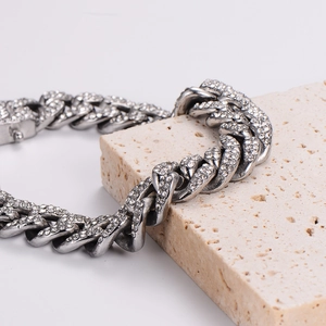 Silver iced out Cuban link chain with sparkling rhinestones in a hip hop style
