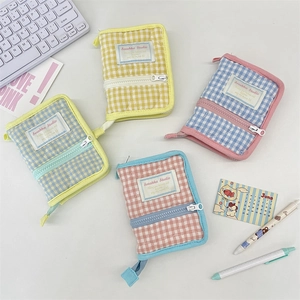 Quilted cotton macaron zipper binder covers set on a desk with stationery items