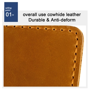 Macro shot of durable brown cowhide leather with precise edge stitching and natural texture